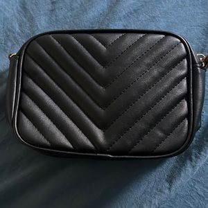 Black purse with gold chain